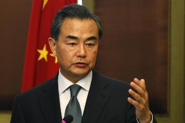 China's Foreign Minister Wang Yi talks during a news conference with Egypt's Foreign Minister Sameh Shoukry in Cairo