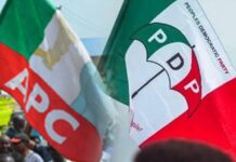 Ex-APC Chieftain Defects to PDP, Leads Thousands of Supporters in Ogun APC and PDP Flags