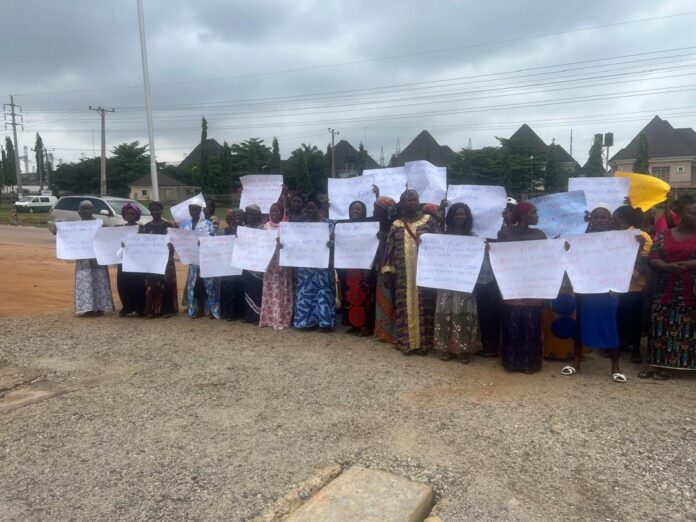 Peaceful protesters carrying placards during a demonstration in Nigeria. Photo taken by Aljazirah Nigeria